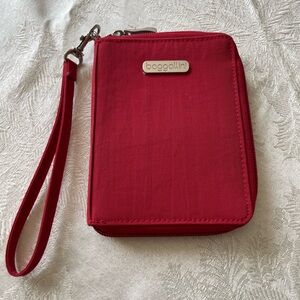 Baggallini Red Zip Wristlet Travel Wallet with Metal Plaque. RFID blocking.